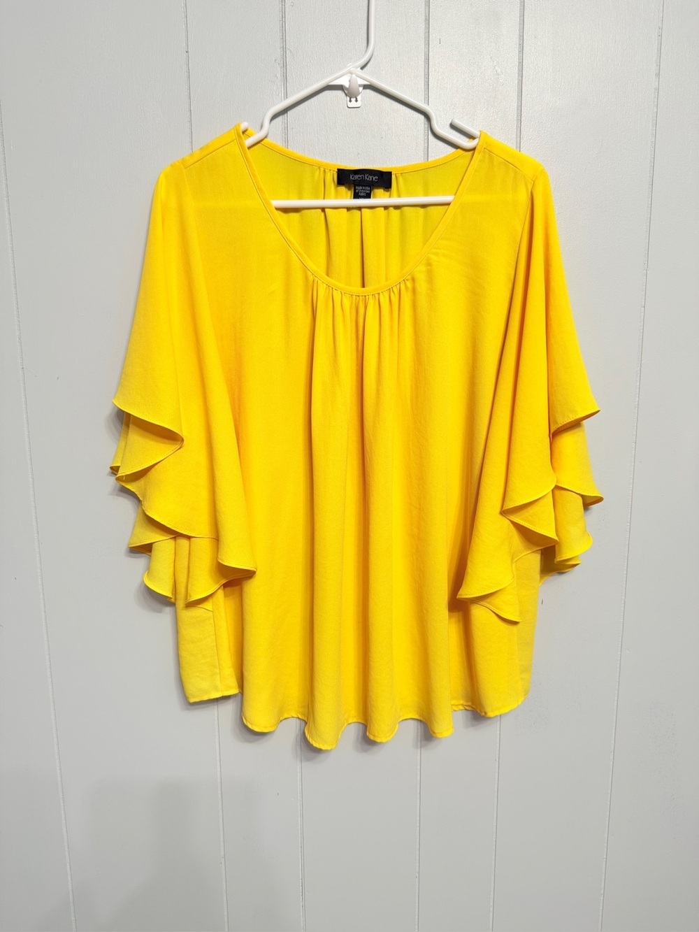 #10) Karen Kane Bright Yellow Ruffle Sleeve Blouse